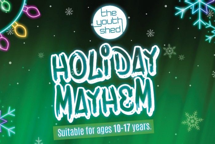 Holiday Mayhem at the youth shed with green background and snowflakes