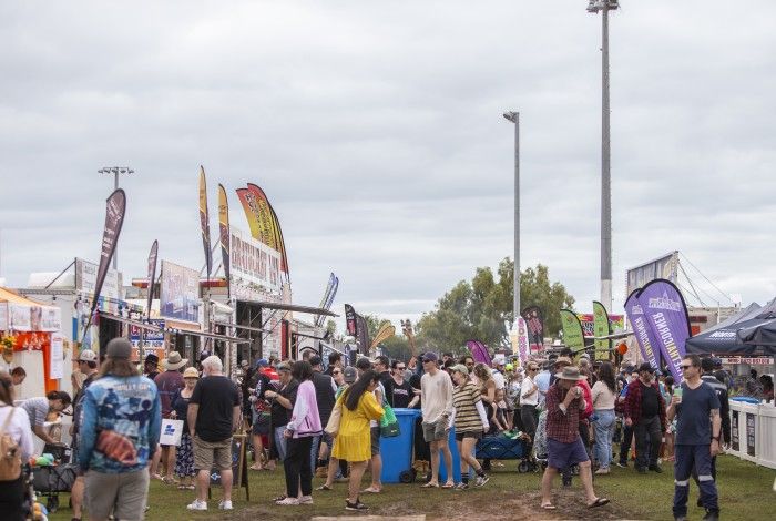 People walking around town festival/fare