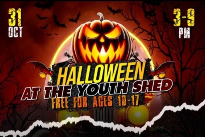 A dark Halloween-themed graphic featuring a glowing jack-o’-lantern pumpkin with sinister eyes and a smile, rising above a spooky scene with bats flying in the background. The text reads: “Halloween at The Youth Shed – Free for ages 10-17.” Event details “31 Oct” on the left and “3–9 PM” on the right. The overall design has an eerie orange and black colour scheme with torn white paper effect along the bottom edge.