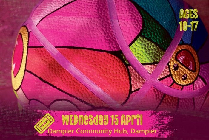 Close-up of a brightly painted basketball with colourful cartoon-style designs. A pink banner reads “Wednesday 15 April – Dampier Community Hub, Dampier,” and text on the right says “Ages 10–17.”