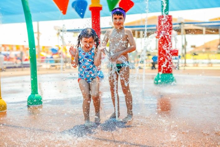 Two children playing at the KLP splash pad