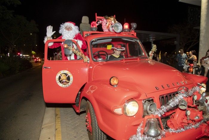 Santa waving from a christmas fire truck